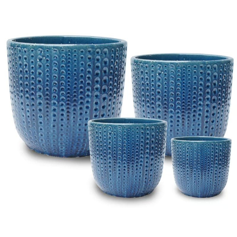A stock photo of a set of four rounded Beaded Egg Pots with a series of beaded or sea-urchin like designs, finished with an uneven crackled navy blue glaze.