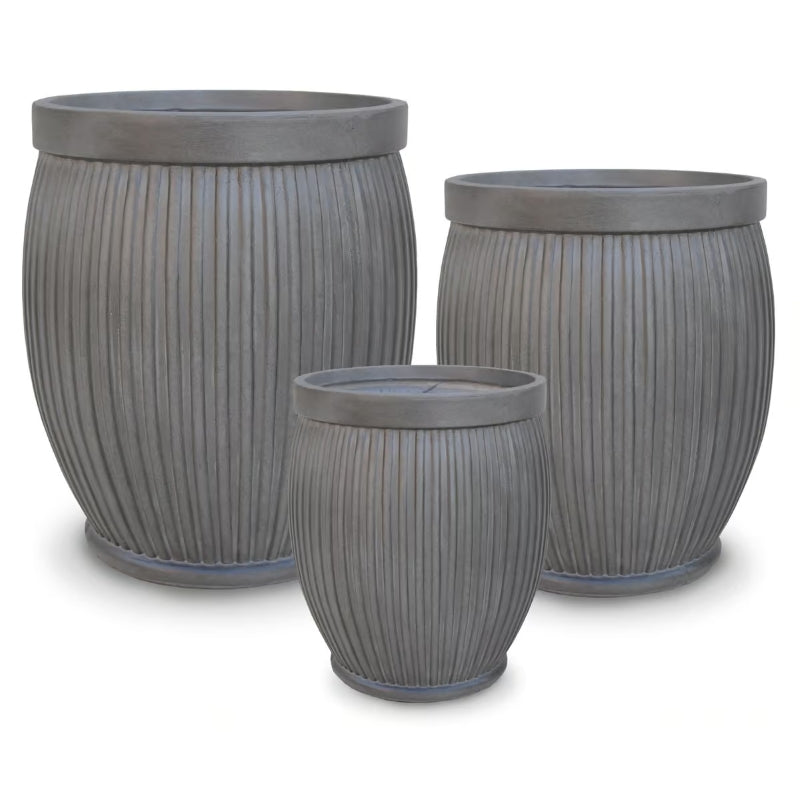 A stock photo of a trio of upright Corduroy Barrel Pots, finished with a ridged design and metallic lead glaze over fiber clay.