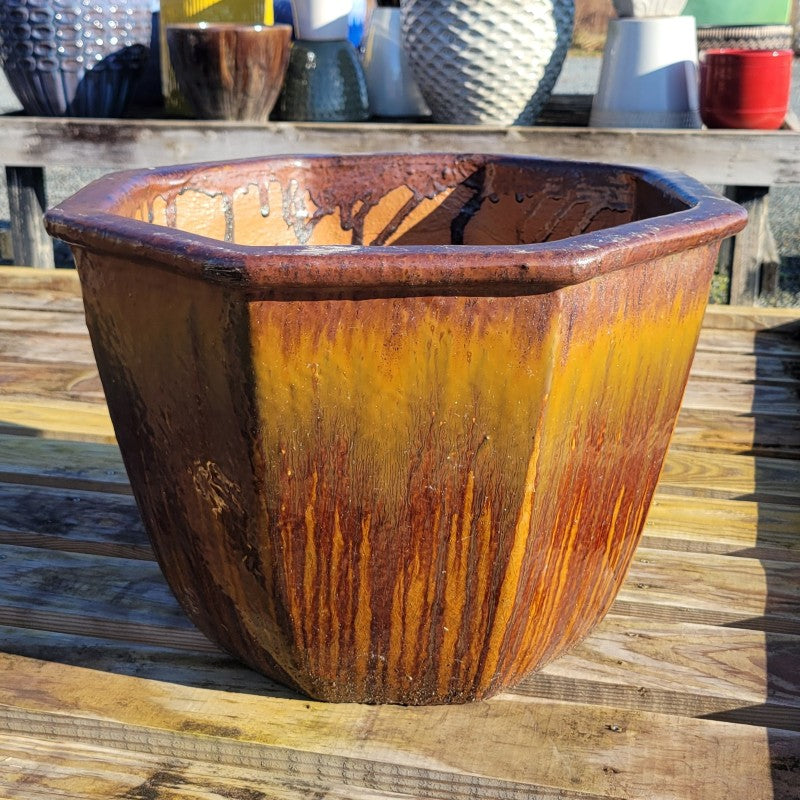 A wide, octagonal Granero planter with tiger's eye brown drip glaze.