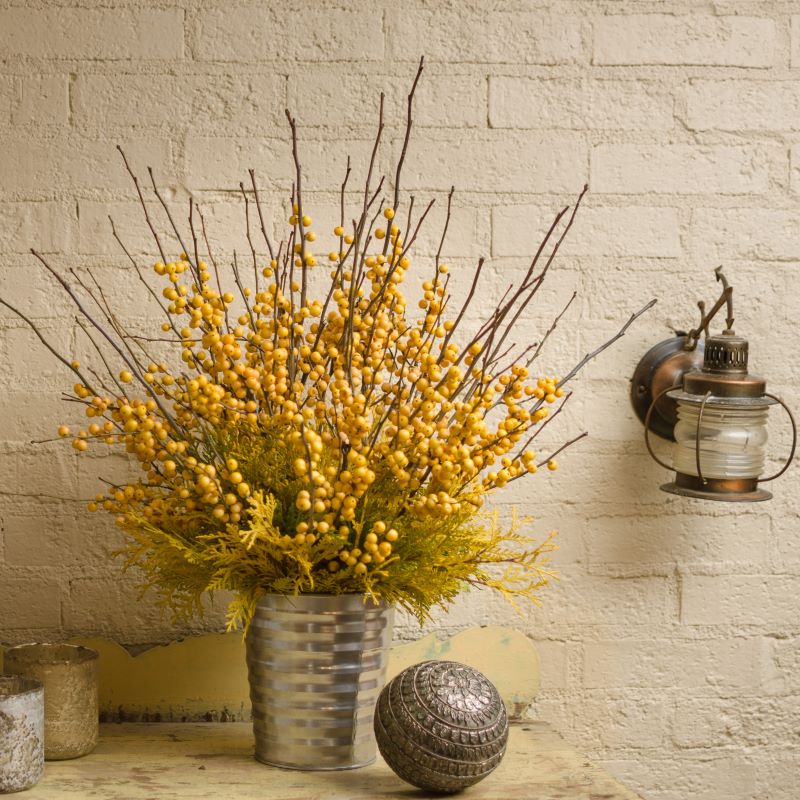 Ilex verticillata Berry Heavy® Gold branches as a cut arrangement.
