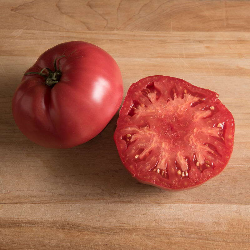 Meaty, Brandywine-type Pruden's Purple tomato with pink skin and bright red flesh.