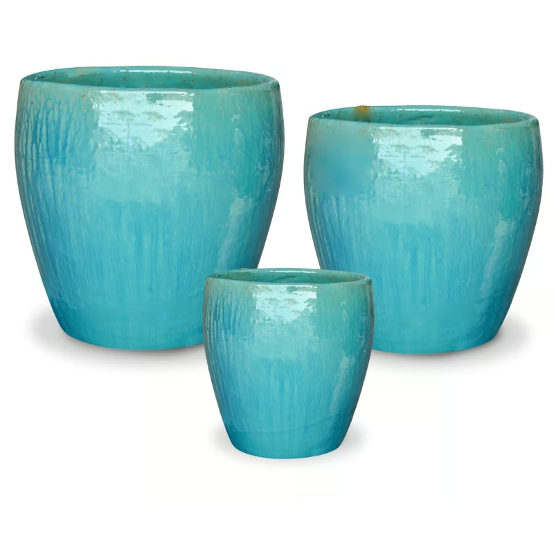 A trio of upright, rounded Raindrop Egg Pots, finished in a Caribbean Blue glaze.