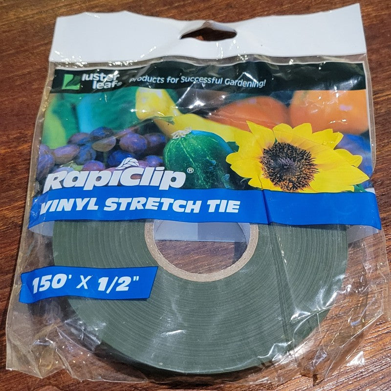 A plastic bag containing a roll of RapiClip Vinyl Stretch Tie (150'x 0.5")