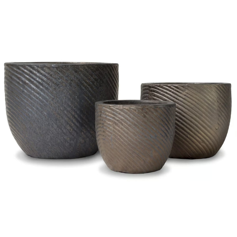 A stock photo of three Thumbprint Egg Pot planters with a ridged thumbprint-like design; finished with a dark bronze glaze.