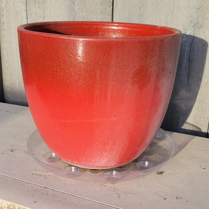 An example photo of a Carpet Saver Plastic Saucer in use underneath an 11.5" Athens pot in Raspberry Gold finish.