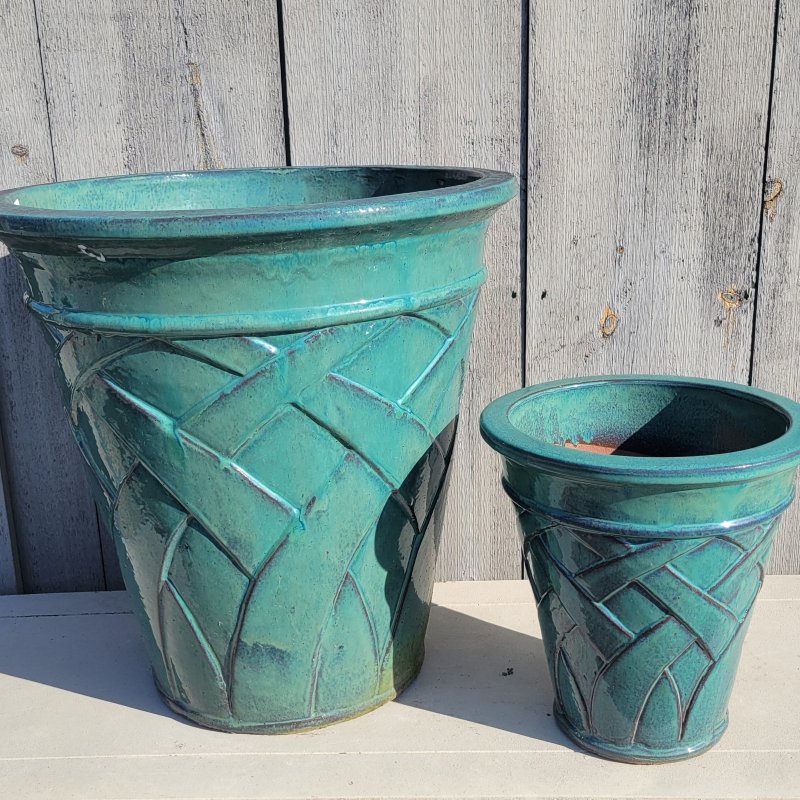 A pair of vase-like blue-green Crossroads Planters with size comparison.