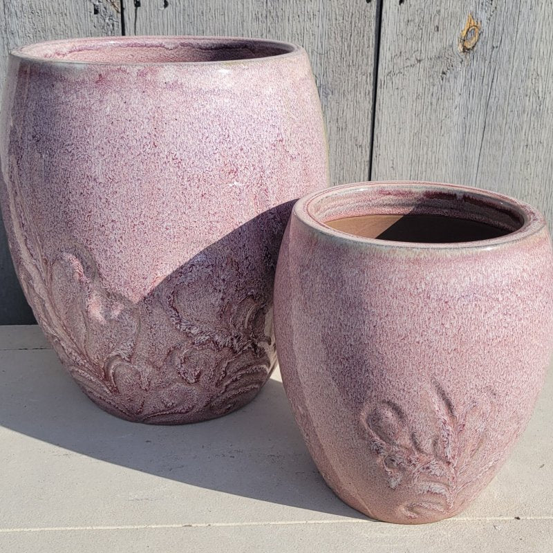 A pair of heathered pink and floral decorated Dawn Mist Planters with size comparison.