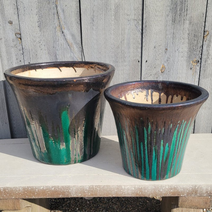 A pair of flared jade green and dark bronze Delphine Planters with size comparison.