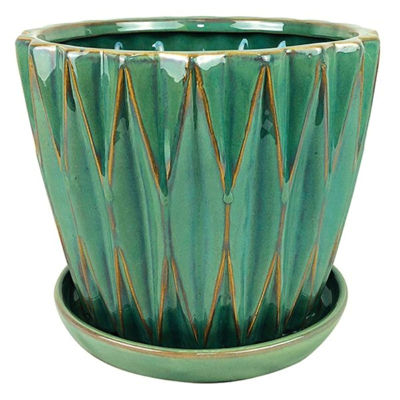 A stock photo of a rounded planter with a built-in saucer, decorated with sculpted multi-dimension geometric design and finished with a sage green glaze.