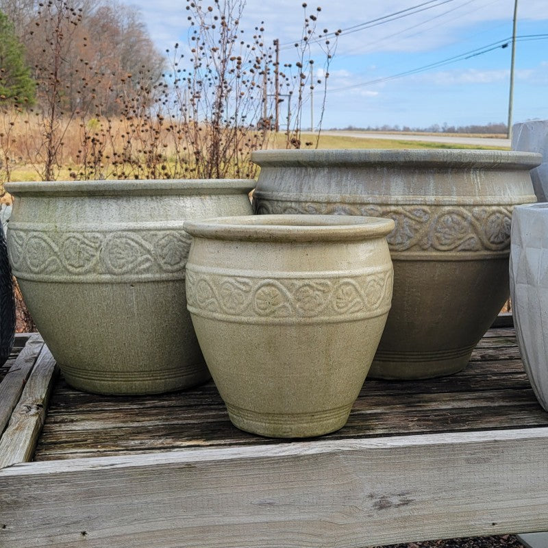 A trio of urn-like Florian Planters decorated with a faux-Florentine style ring design; finished in an antique burnished pearl-white glaze.