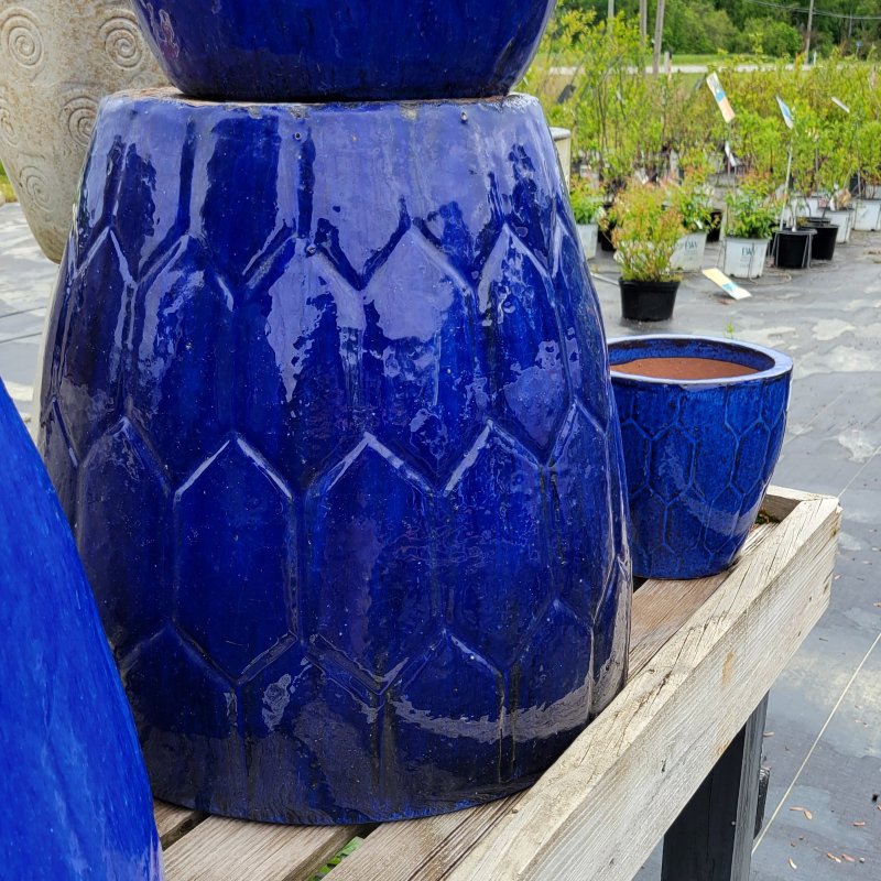 A pair of Geometric Cascade planters with hexagonal design and dark blue glaze