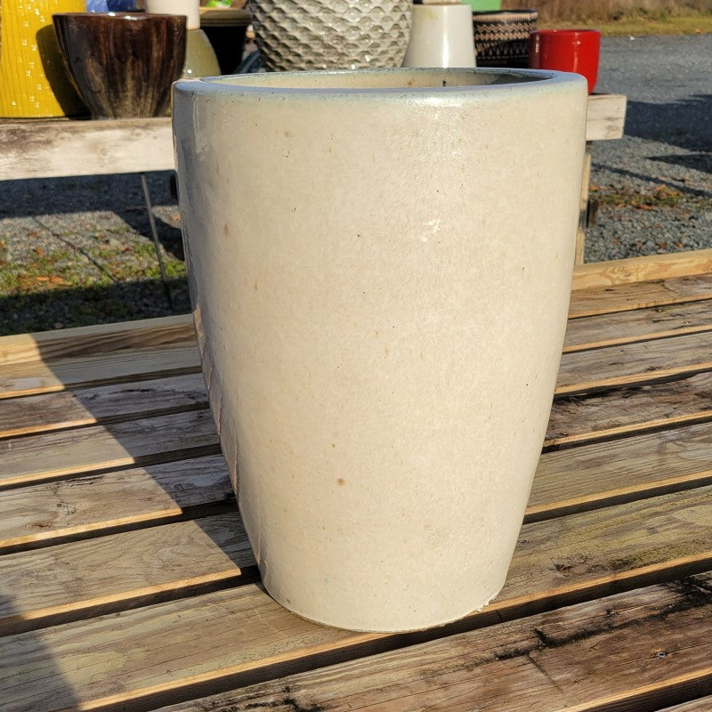 A narrow, rounded Ojai planter with plain, undecorated sides; finished with a pearl-white glaze. 