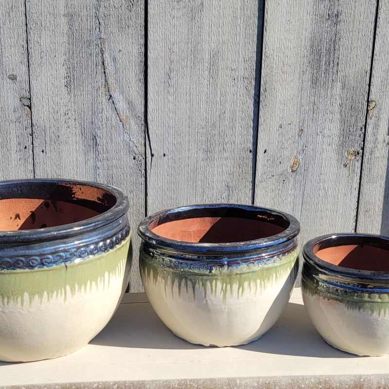 A trio of rounded Ombre Planters with a decorative band of spiral designs under the lip; this trio is cream white, green, and mirror-black, and depicts sizes Extra Large, Large, and Medium.