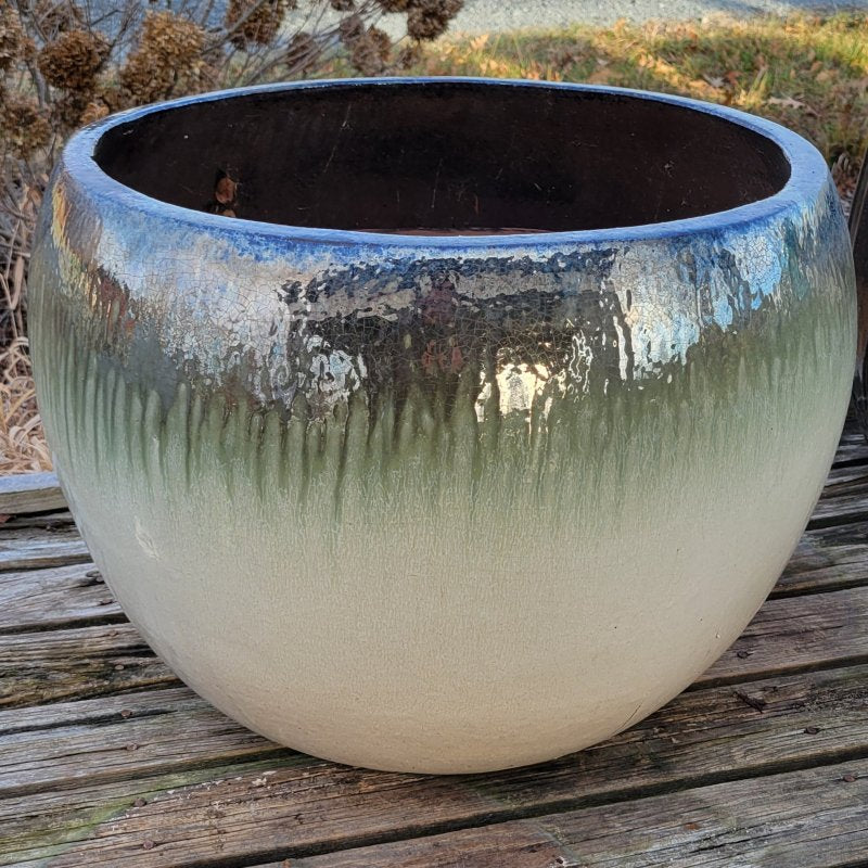 A large Oval Planter with multi-color ombre glaze and bowed walls.