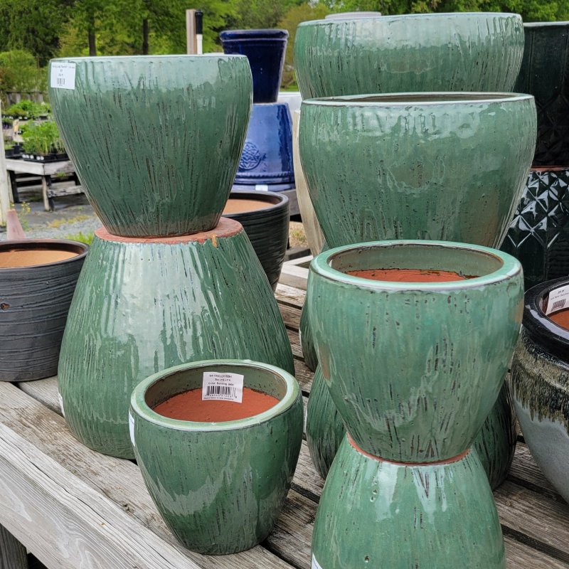 A collection of grooved Running Jade planters in a number of different sizes