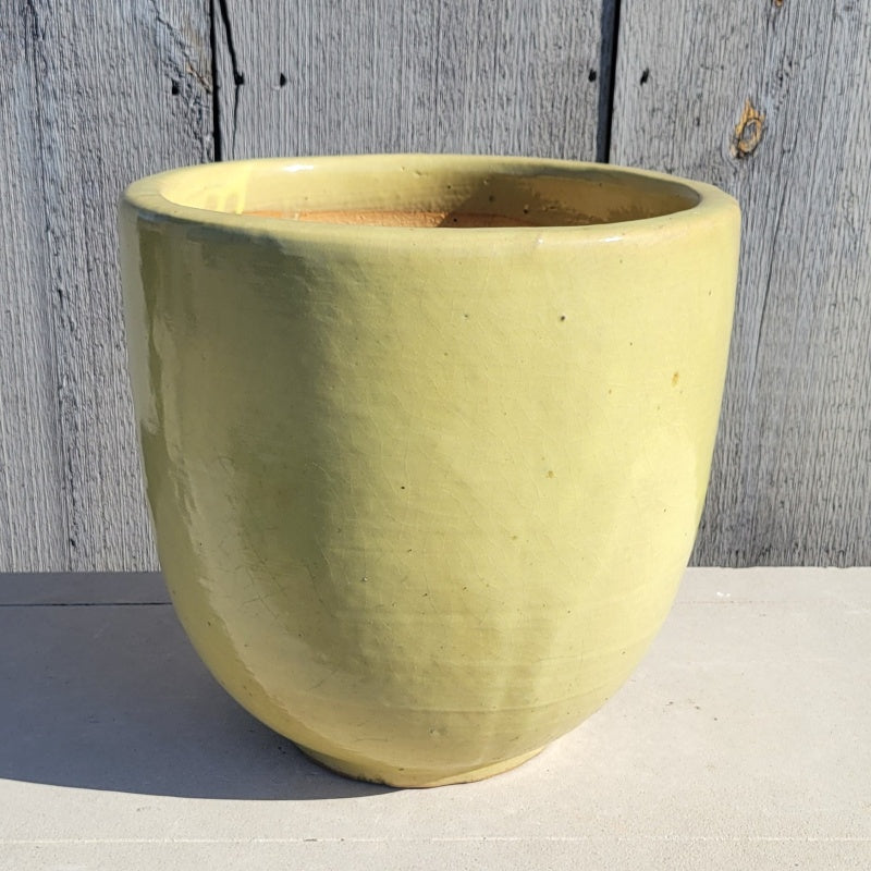 A single, undecorated Sem Shape Planter, finshed in a Sunshine Yellow glaze.