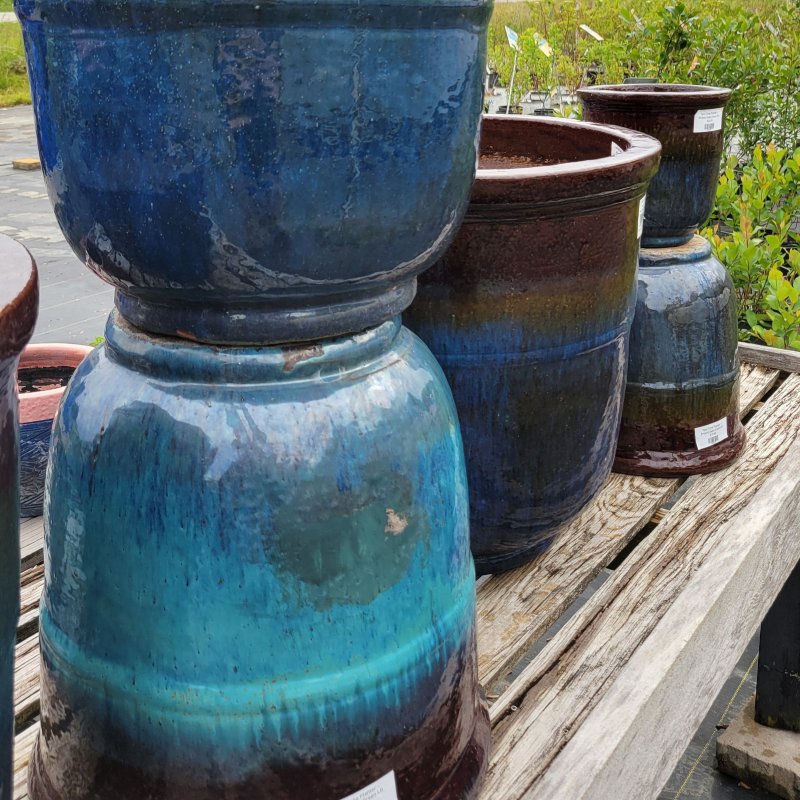 A  collection of bluish-green and copper brown Two-Tone planters