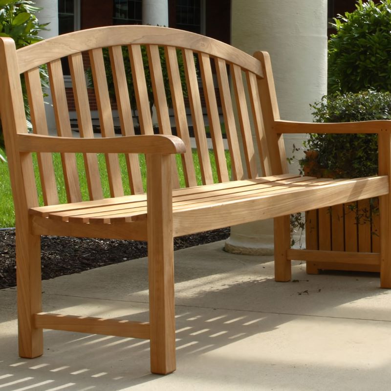 A 5' Victoria Bench placed alongside a walking path in an estate property.