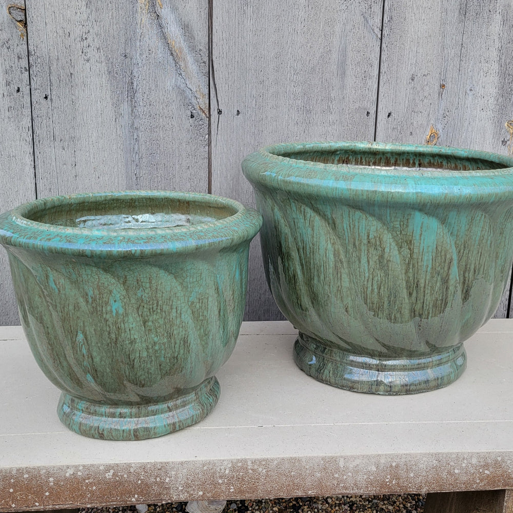 A pair of sea-foam green 'Glacier' glazed Wave Planters, one smaller and one larger.